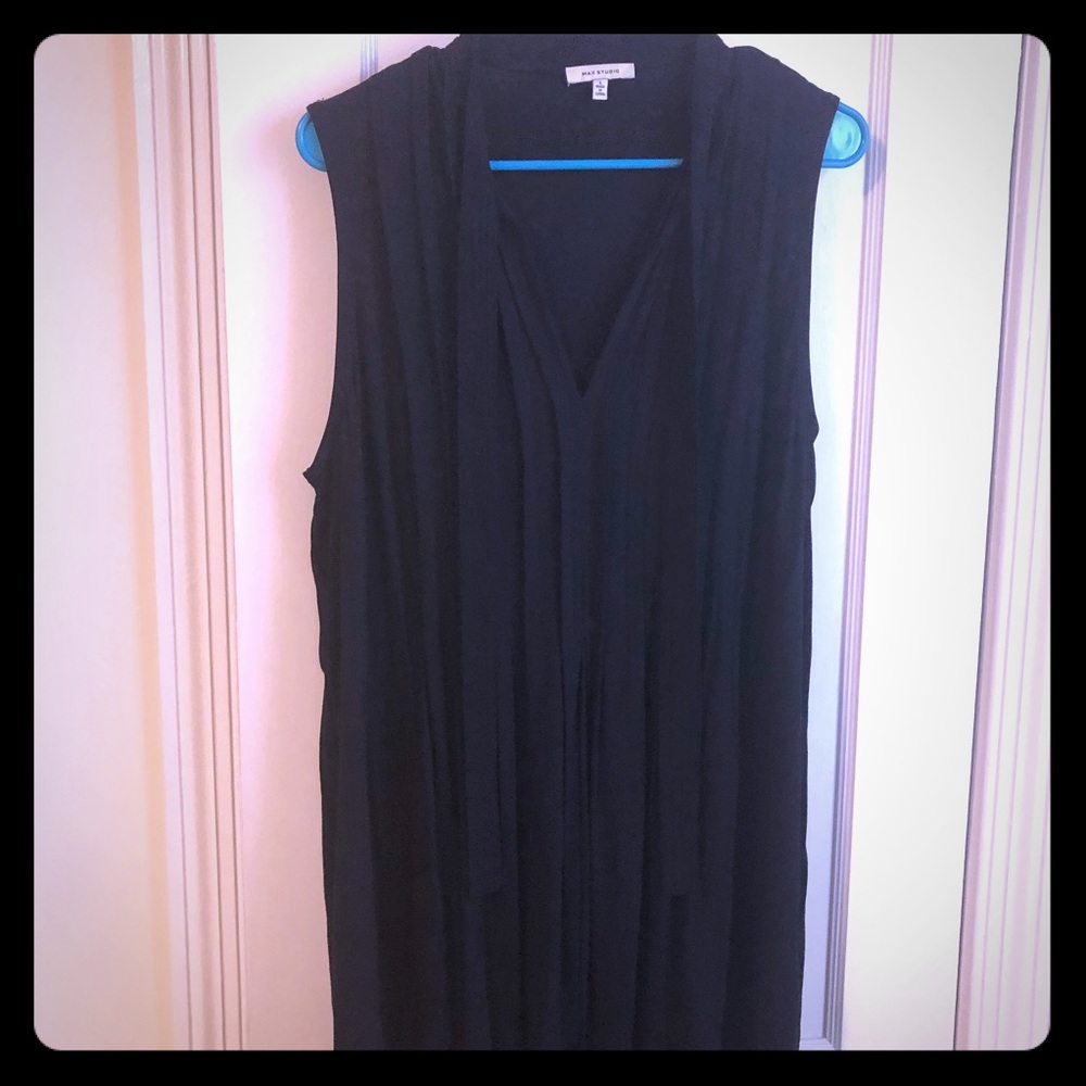 Black sleeveless pleated front dress with tie neck